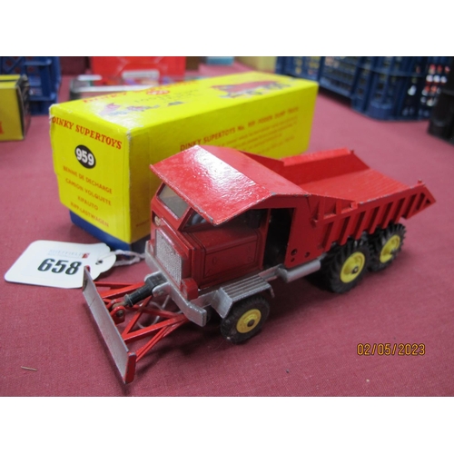 658 - Dinky Toys - A boxed 959 Ford dump truck, red livery with yellow hubs, (light use marks, chips), box... 