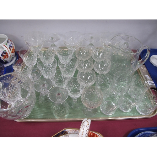 1180 - A Suite of Edinburgh Crystal Stemware, comprising five sets of each size glass, a water jug and an E... 