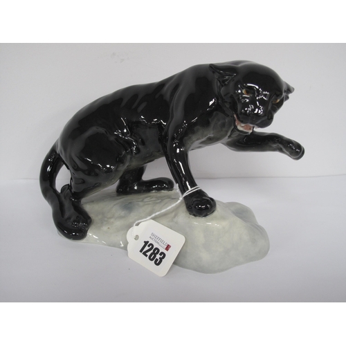 1283 - Beswick Black Puma on Rock, numbered 1823, 13cm high.