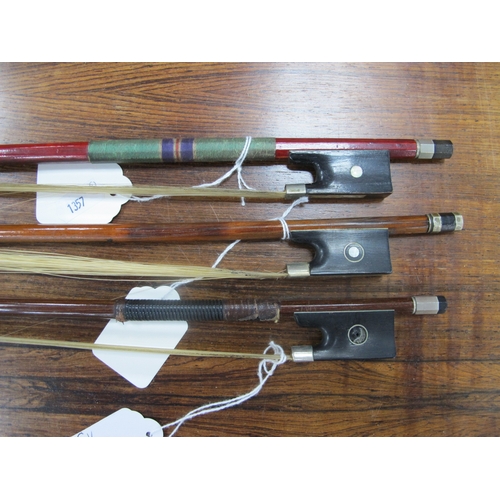 1357 - Three Violin Bows, each with nacre inset to frog, approximately 74cm long. (3).