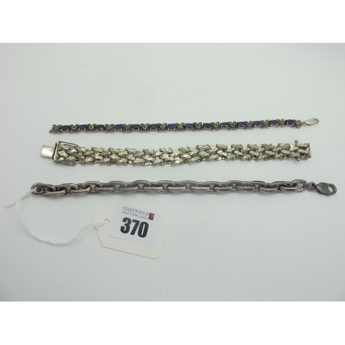 370 - An Amethyst and Marcasite Set Line Bracelet, oval claw set with cross design spacers, stamped 