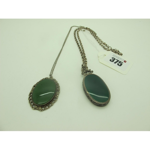 375 - A Large Oval Panel Pendant, inset green and black, below scroll surmount, on a belcher link chain; t... 