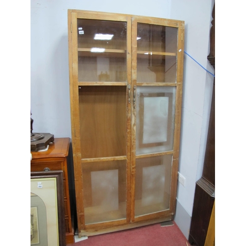 1477 - A Pine Bookcase, with glazed doors, 92cm wide x 184cm high.