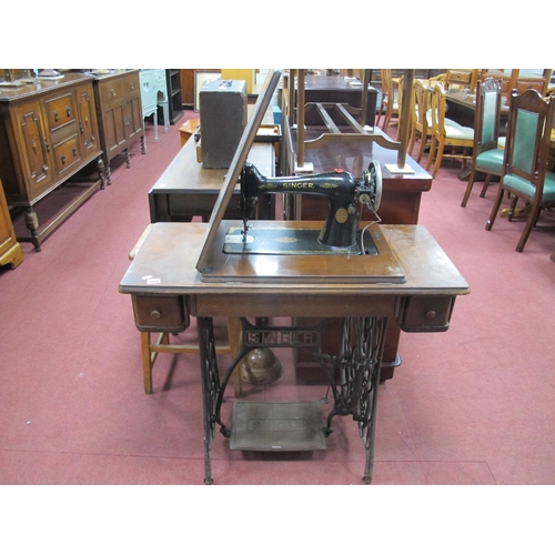 1488 - A Singer Treadle Sewing Machine, with accessories in two drawers.