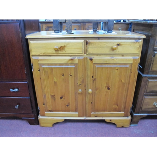 1492 - Pine Cabinet The Top, with a moulded edge, two small drawers, twin panelled cupboard doors, on brack... 