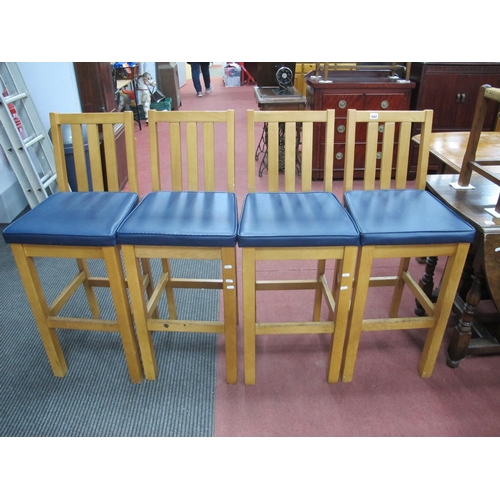 1502 - A Set of Four High Bar/Kitchen Chairs, in light wood with blue padded seats.