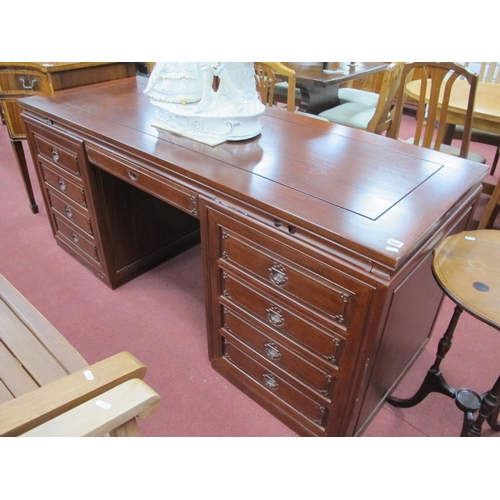 1512 - A Chinese Hardwood Pedestal Desk, with brushing slides, central drawers, flanking pedestals, with cu... 