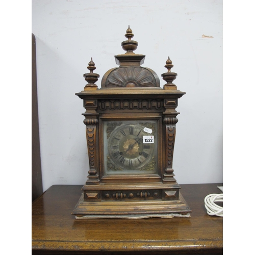 1522 - A Late XIX Century Walnut Mantel Clock, with turned finial's, arched top, square dial, Roman numeral... 