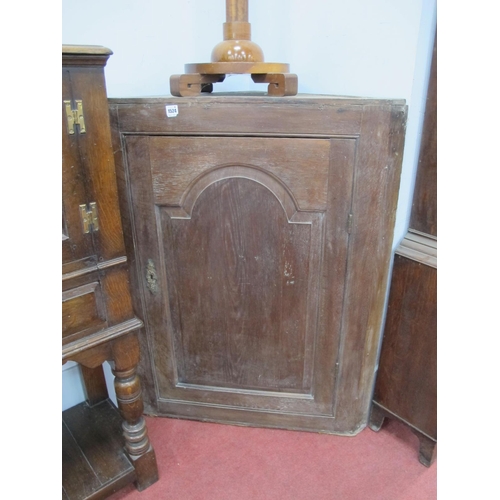 1524 - An XVIII Century Oak Corner Cupboard, with arched door, 111cm high.