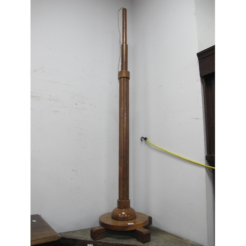 1525 - a 1920's Walnut Art Deco Standard Lamp, with a moulded pedestal circular base, on four block support... 