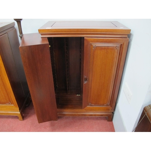 1528 - A Chinese Style Hardwood C.D Cabinet, with hinged panelled doors, 60cm wide.