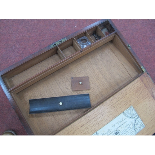 1389 - A XIX Century Mahogany Writing Slope, with brass corner mounts, escucheon to handle to side drawer, ... 