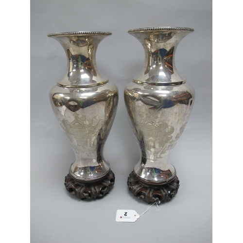 2 - A Pair of Chinese Baluster Vases, each detailed with waterside dwellings, figures and boats, with va... 