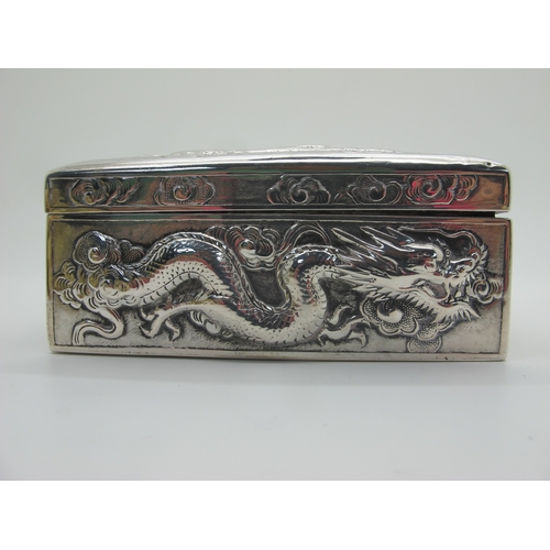 13 - Zeewo; A Chinese Trinket Box, allover profusely detailed in relief with sinuous dragons, with hinged... 