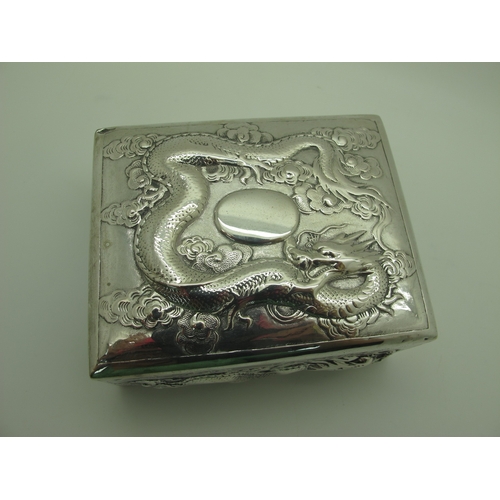 13 - Zeewo; A Chinese Trinket Box, allover profusely detailed in relief with sinuous dragons, with hinged... 