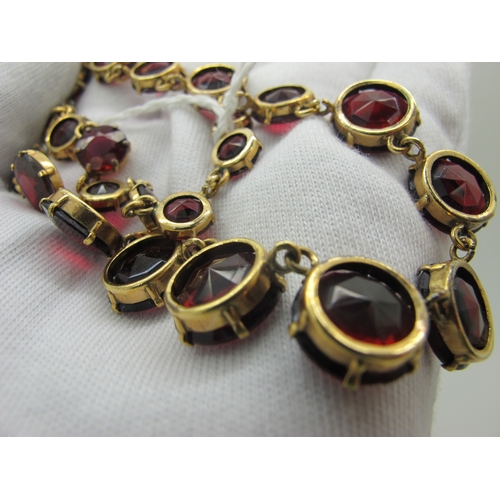 125 - A Riviere Style Necklace, graduated circular claw set, in an associated fitted case.