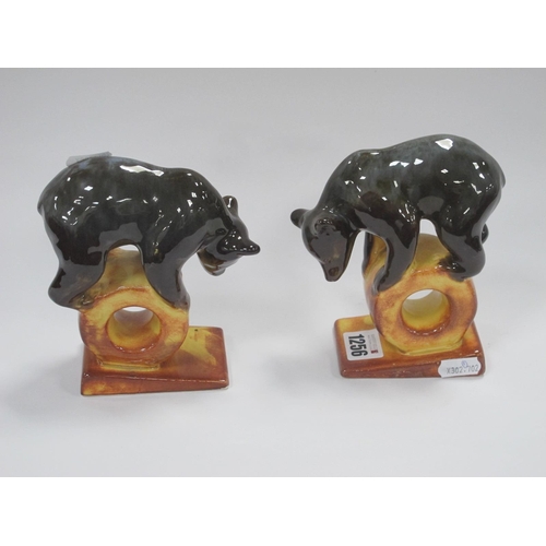 1256 - USSR Bear Balanced on a Wheel on Ramp, numbered '67', 14cm high, another '86'. (2).