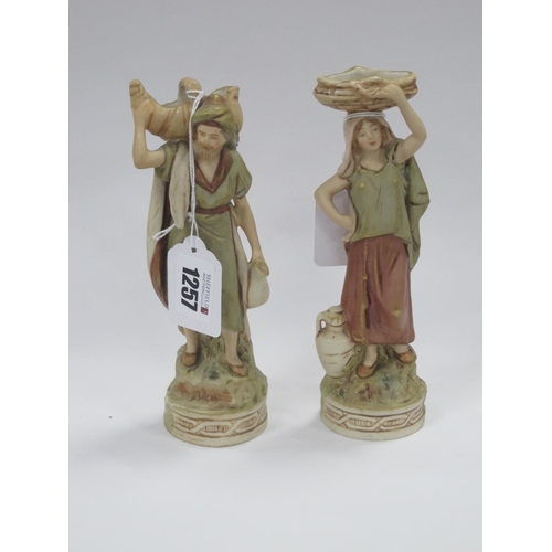 1257 - A Pair of Royal Dux Figures, both carrying baskets, 18.5cm high.