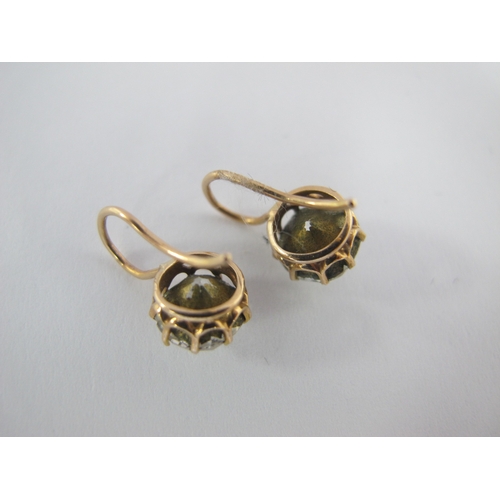 98 - A Pair of Antique Style Single Stone Earrings, each claw set on hook fitting.