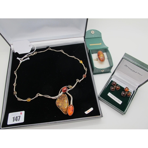 147 - A Modern Amber Coloured Necklace, of abstract design, collet set, clasp stamped 