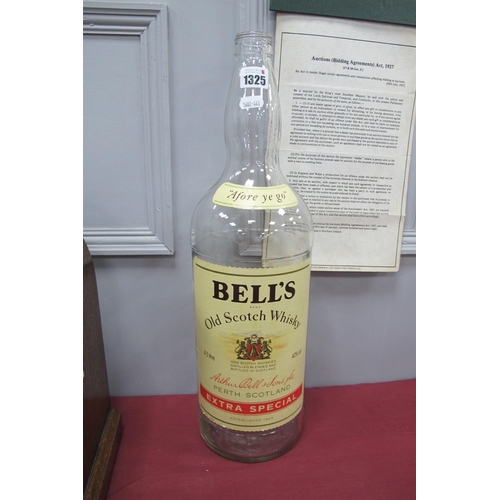 1325 - An Empty 4.5 Litre Bells Whisky Bottle.