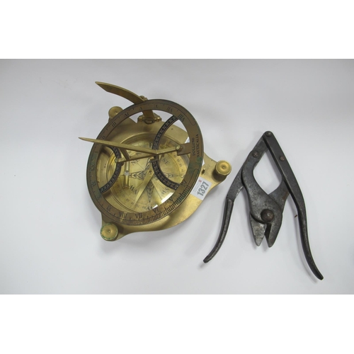 1327 - A Brass Sun Dial, together with a folding pair of clippers, stamped 1917, 31