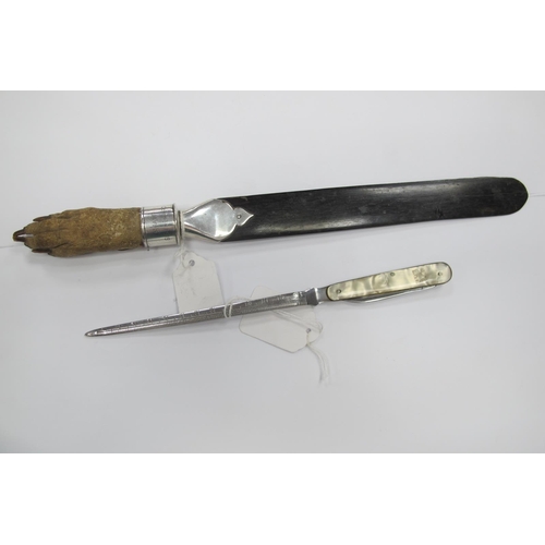 1308 - An Early XX Century Ebony Page Turner, with animal claw handle, silver hallmarked band with inscript... 