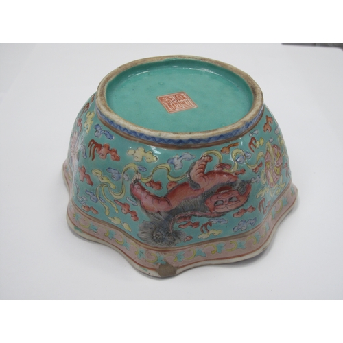 1326 - Oriental - Pottery bowl decorated with three temple lions on turquoise ground, with wavy rim, 14cm w... 