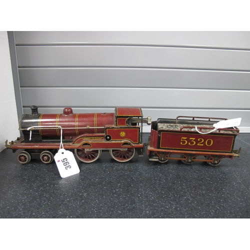 395 - A Bassett Lowke 'O' Gauge/7mm Clockwork 4-4-0 Steam Locomotive, with six wheel tender, L.M.S maroon ... 