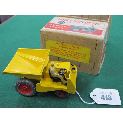 413 - A Dinky Supertoys No 562 Dumper Truck, yellow body, red hubs, beige driver,multiple chips to paint w... 