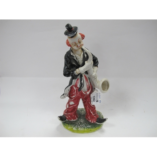1262 - A vintage hand painted figure of a clown playing the saxophone, unmarked but in the style of R Ferol... 