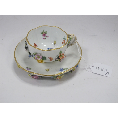 1283a - A XIX century Meissen cabinet cup and saucer painted with flowers and insects (with cross swords mar... 