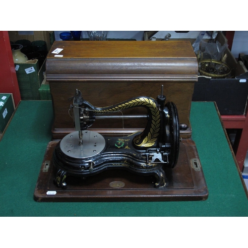 1038 - Late XIX Century Jones Swan Neck Sewing Machine, (cased).