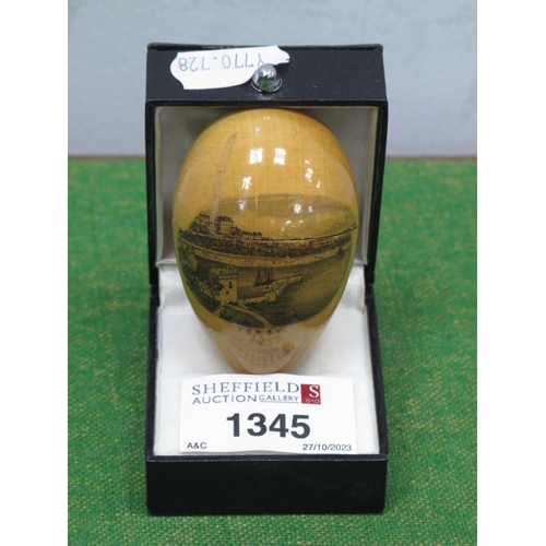 1345 - Treen, cotton reel holder as an egg, featuring a scene of Tenby, 6cm long.