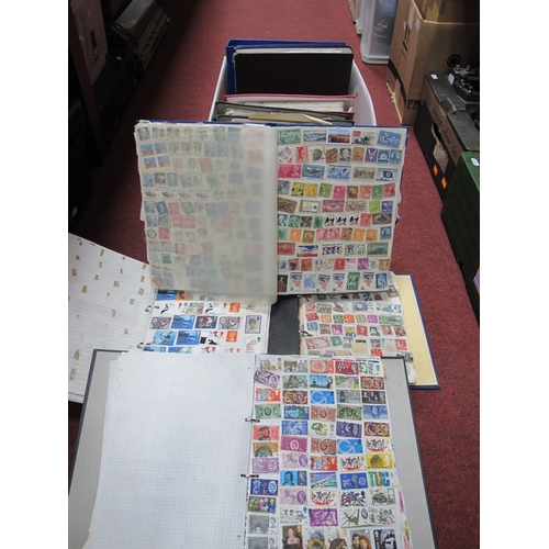 1023 - World stamps haphazardly mounted in eleven albums, includes some duplication.