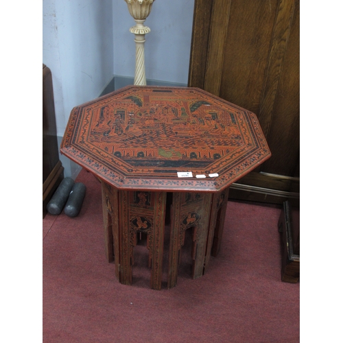 1535 - Oriental, octagonal-topped lacquered coffee table, possibly Burmese, decorated with figures in a tem... 