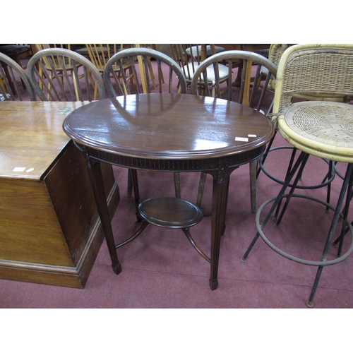 1537 - Early XX Century Mahogany Occasional Table, with an oval top, reeded frieze, tapering legs united by... 