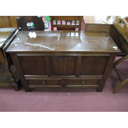 1545 - XX Century Oak Blanket Box, with a hinged lid, linen fold panel, over two small drawers, on stile fe... 