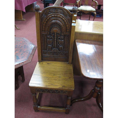 1550 - Joined Oak Hall Chair, with a carved panel back, solid seat, on turned and block supports (with init... 