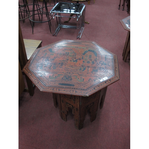 1551 - Oriental, octagonal-topped lacquered coffee table, possibly Burmese, decorated with figures in a tem... 