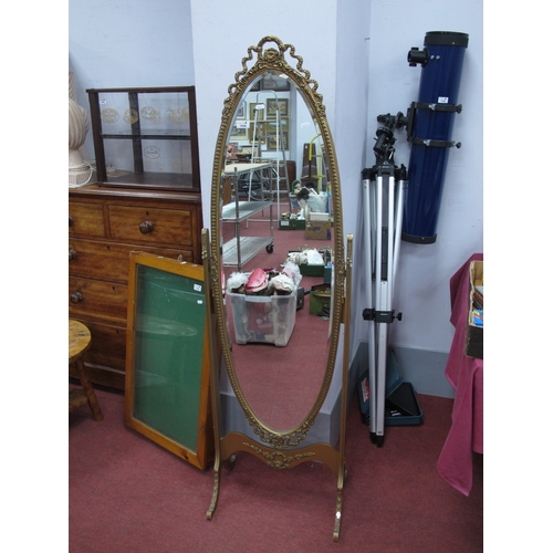 1558 - XX Century Gilt Cheval Mirror, top with ribbon decoration, oval beveled mirror, on shaped supports, ... 