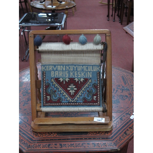 1561 - A Mid XX Century Pine Carpet Shop Advertising Loom, showing part handmade carpet with lettering 