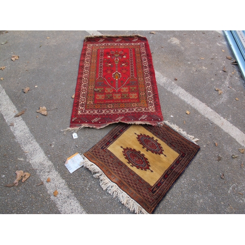 1568 - A Far Eastern Wool Rug, the centre with geometric flower head design within a geometric border, in m... 