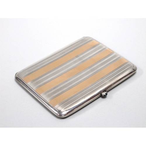 13 - An Art Deco Style Two Colour Slim Rectangular Cigarette Case, (indistinct stamped marks) of polished... 