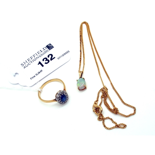 132 - A Sapphire and Diamond Cluster Ring, oval claw set within illusion border, stamped 