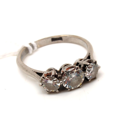 139 - A Three Stone Diamond Ring, the graduated brilliant cut stones claw set, stamped (finger size P).