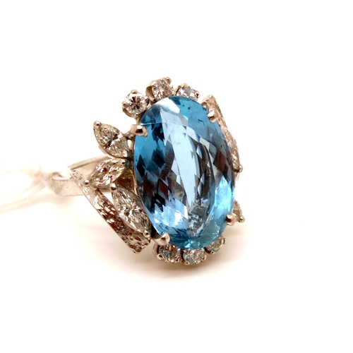 142 - A Large Aquamarine and Diamond Set Cocktail Ring, oval four claw set to the centre, within shaped cl... 