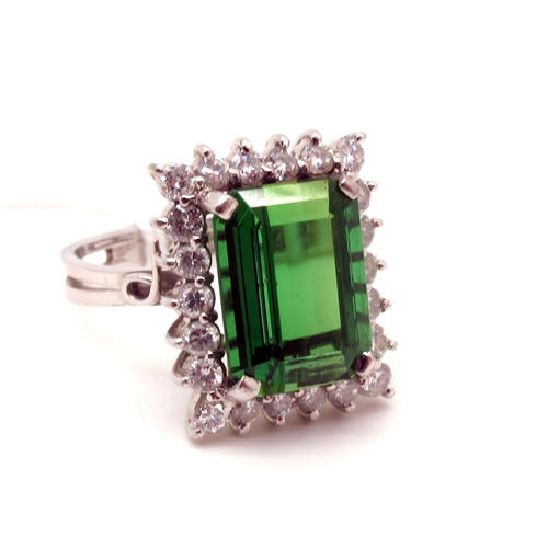 143 - A Large Tourmaline and Diamond Set Rectangular Cluster Ring, four claw set to the centre within claw... 