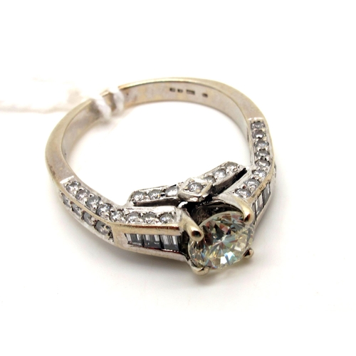 147 - A Bespoke Modern Single Stone Diamond Ring, the brilliant cut stone four claw set high between brill... 