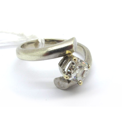 175 - A Modern Asscher Cut Single Stone Diamond Ring, four claw offset between plain crossover shoulders, ... 